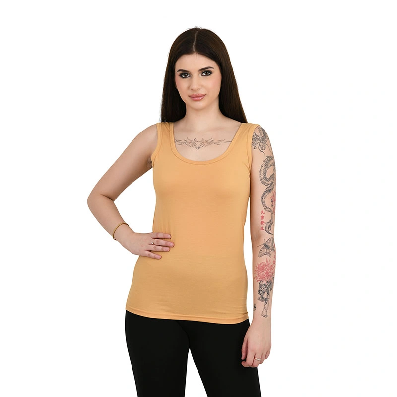 Mustard gold sleeveless camisole tank top with black leggings - fashion ecommerce photography by Lohar Studio Delhi